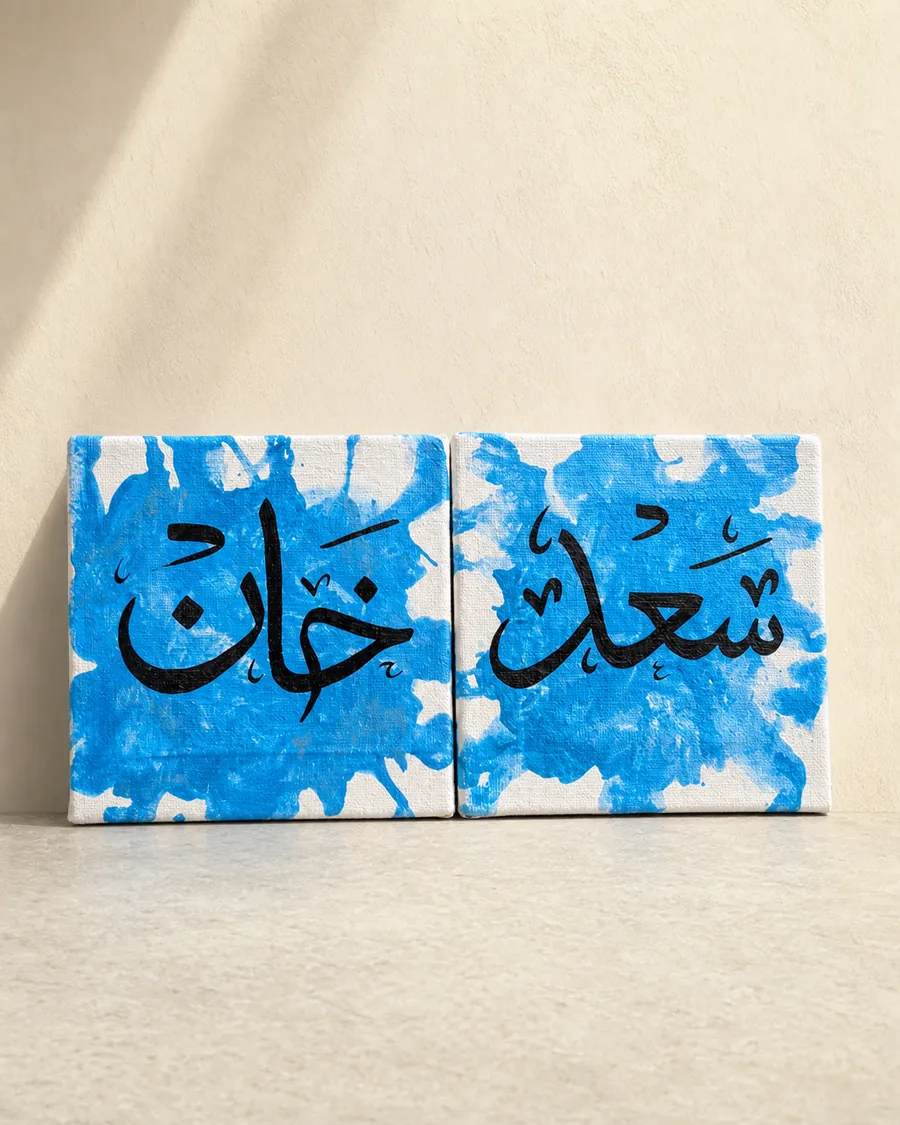 Two handmade blue and black calligraphy canvas paintings photographed as a gallery product shot